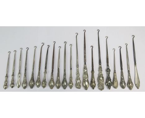 A collection of twenty silver and silver plated handled button hooks, various makers, and designs. (20)