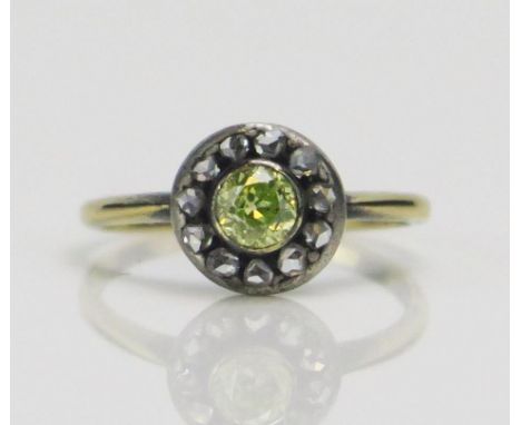 An Antique Green Diamond and Rose Cut Cluster Ring in a high carat precious yellow and white metal setting, c 4.2mm rub over 