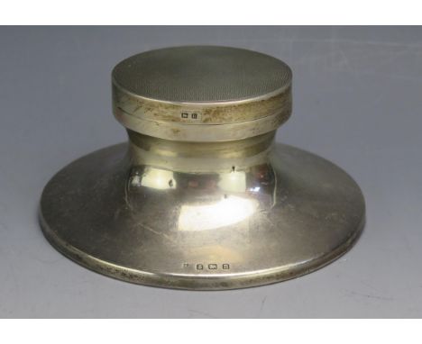A George V silver capstan inkwell, maker William Neale &amp; Son Ltd, Birmingham, 1912, of oval outline with engine turned de
