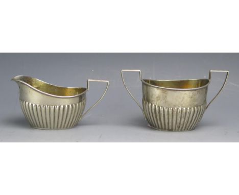 A sterling silver sugar basin and matching cream jug with half reeded decoration, 83gms, 2.67ozs
