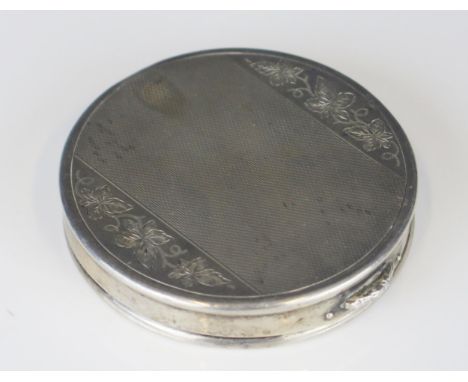An Elizabeth II silver compact, maker Charles S Green &amp; Co Ltd, Birmingham, 1963, of circular outline with engine turned 