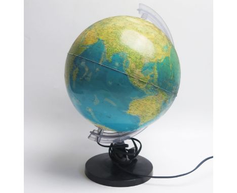 A 10ins illuminated terrestrial table lamp, on circular plastic stand.