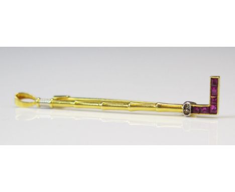 An 18ct Gold, Ruby and Rose Cut Diamond Millegrain Set Riding Crop Brooch, 42.7mm, stamped 750, 1.79g