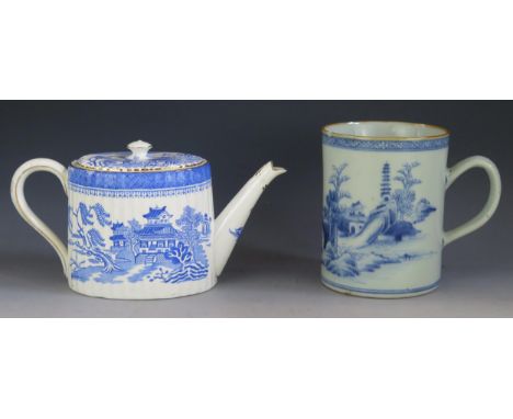 A 19th century Chinese blue and white mug, of cylindrical form with landscape decoration, 14.5cm high, (chip to rim) together