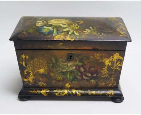 A 19th century papier mache tea caddy, of rectangular outline, the hinged lid enclosing two lidded zinc foil lined compartmen