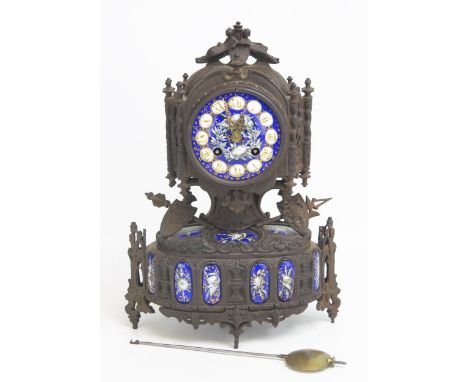 A19th century metal and enamel mantel clock, with 8.5cm Roman dial, the case with applied military trophies, the French circu
