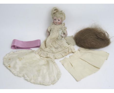 A German bisque head character doll, impressed D1/2, Made in Germany 8 1/2, with fair mohair wig, weighted blue eyes, closed 