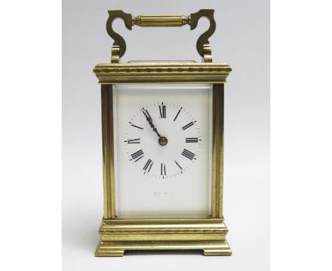 A French lacquered brass carriage clock, the 7.5cm roman dial with lever platform escapement striking the hours and half hour