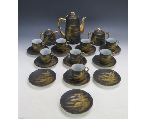 A Noritake porcelain coffee service, with gilded landscape decoration to a black ground, includes Coffee pot, sugar basin , c