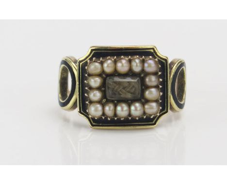 A Georgian Memorial Ring with a central panel of platted hair with a border of split pearls, further bordered by black enamel