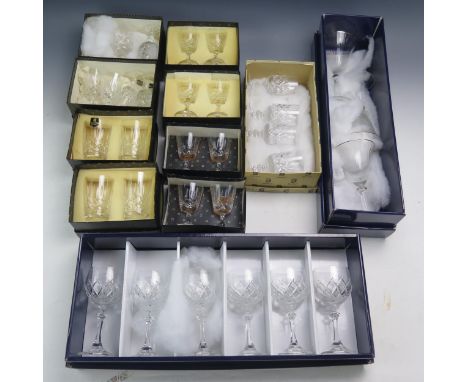 A collection of Edinburgh crystal and other glasses including whiskey tumblers, tots, wine glasses, most boxed.