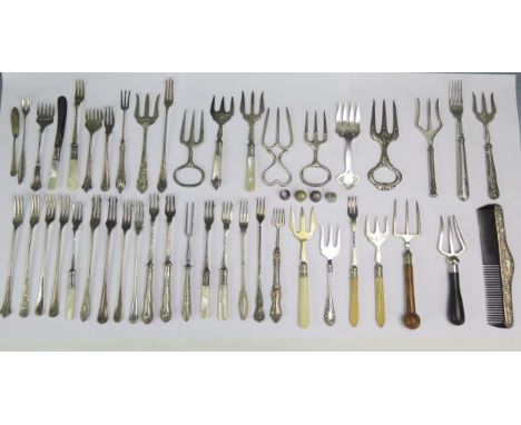 A cpo0llection of silver plated flatwares including pickle forks, ham forks, silver mounted comb, etc.