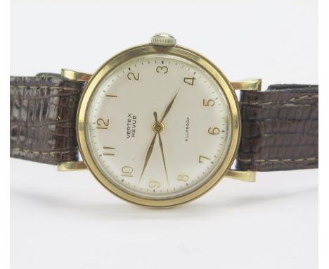 A VERTEX REVUE 9ct Gold Presentation Wristwatch, c. 33.5mm case, manual wind caliber 350 movement. Running