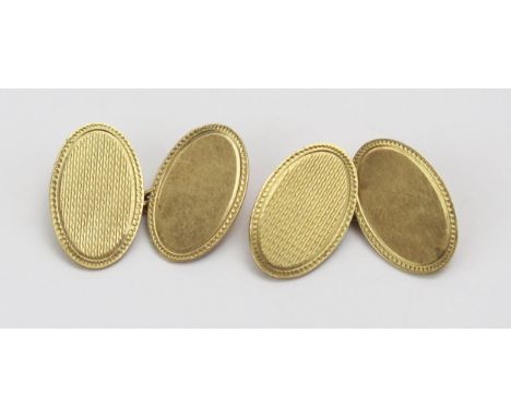 A Pair of 9ct Gold Cufflinks with engine turned decoration, hallmarked, 6.62g