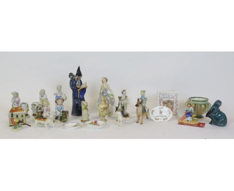 A Poole Pottery model of an otter, Doulton figure of a wizard,, together with other assorted figures and vases