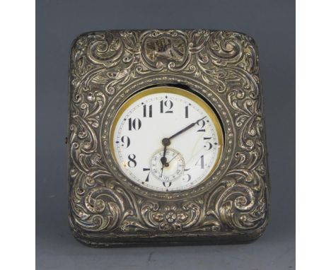 A steel cased pocket watch, with 5.5cm Arab dial, subsidiary seconds dial, contained in a silver easel travelling frame, (wat