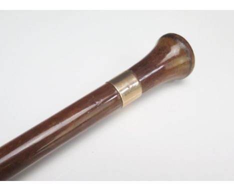 A polished wood and 9ct gold mounted walking stick, initialled, 81cm long.