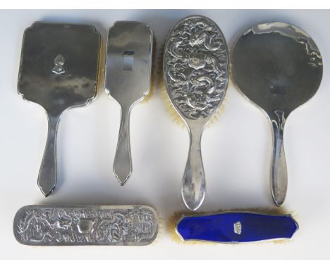 A mixed collection of silver backed brushes and hand mirrors, various makers and dates including Chinese example.
