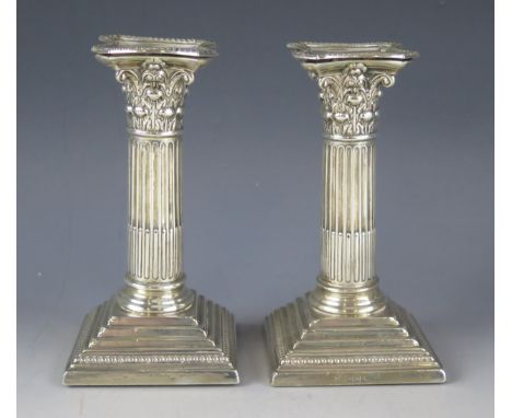 A pair of George  VI silver Corinthian candlesticks, maker William Hutton &amp; Sons Ltd, Sheffield, 1925,  with stop fluted 