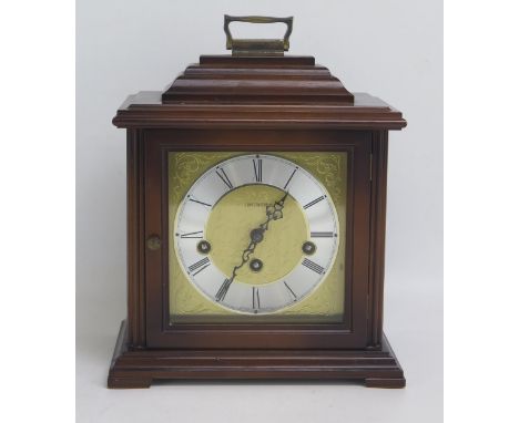 A modern mantel clock with 16cm square gilt brass Roman dial, the movement striking to gongs