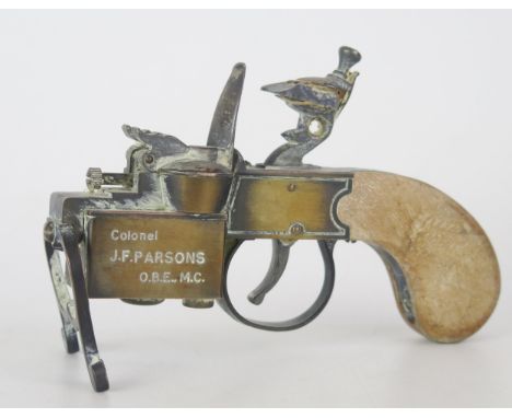 A Dunhill novelty lighter in the form of a flintlock tinderbox, presentation inscription, with bronze effect cast body, woode
