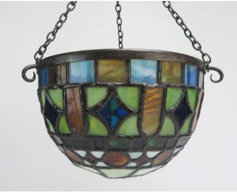 A leaded glass lamp shade of domed form, 20cm diameter.