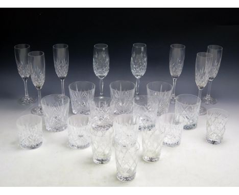 A set of eight Edinburgh crystal glass wine flutes, six crystal glass whiskey tumblers, four smaller tumblers, another four c