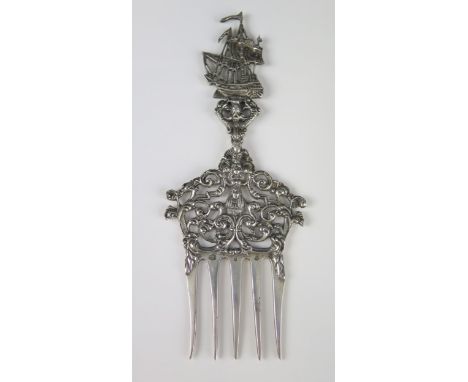 A Dutch silver fork, with pierced scrolling decoration and galleon terminal, 19cm long, 84gms, 2.71ozs