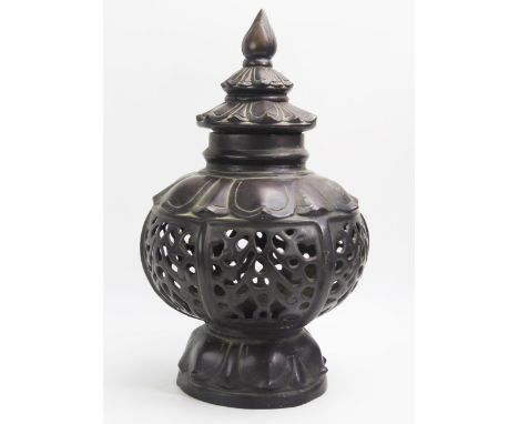 A large Chinese bronze lantern cover, with pierced and lotus leaf decoration. 46cm high