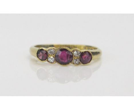 An Antique 18ct Gold, Ruby and Old Cut Diamond Ring, c. 4.47x3.96mm principal pigeon blood stone, size L.5, Birmingham 1916, 