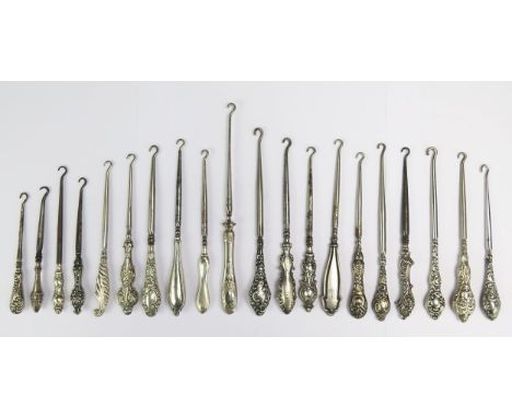 A collection of twenty silver and silver plated handled button hooks, various makers, and designs. (20)