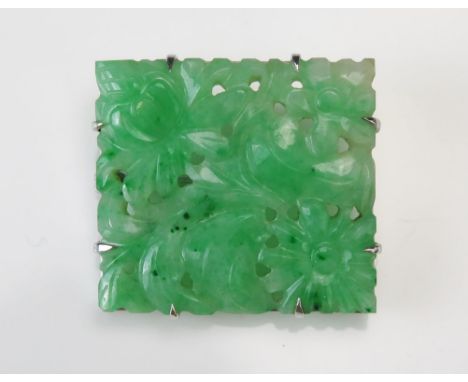 A 9ct White Gold and Carved Jade Panel Brooch with pierced foliate decoration, 26.9x24.6mm, stamped 9CT, 6.55g