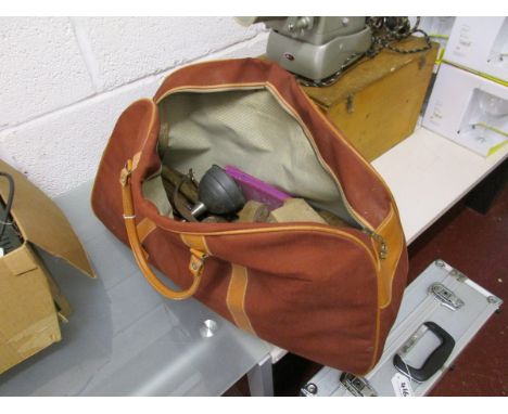 Collection of various tools in canvas bag