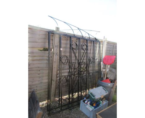 Large pair of metal driveway gates and small garden gate