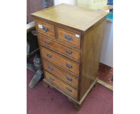 Small reproduction mahogany chest of 2 over 4 drawers on bracket feet