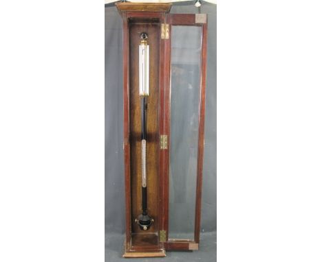 A MAHOGANY CASED ENAMELLED BRASS STICK BAROMETER and thermometer by Negretti &amp; Zambra of London, serial no. M/6229. 96cm 