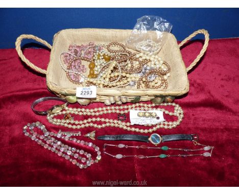 A wicker tray with a quantity of pearls, Timex watch, Citrine brooch, glass beads etc.