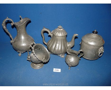 A selection of pewter to include; tea caddy, teapot, decanter, sugar bowl and scuttle scoop.