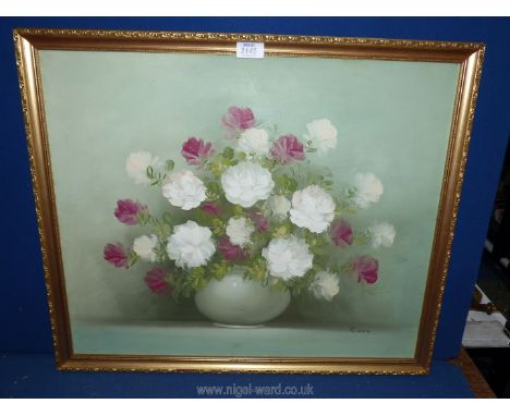 A framed Oil on canvas depicting a vase of flowers, signed lower right R. Cox, 26" x 22".