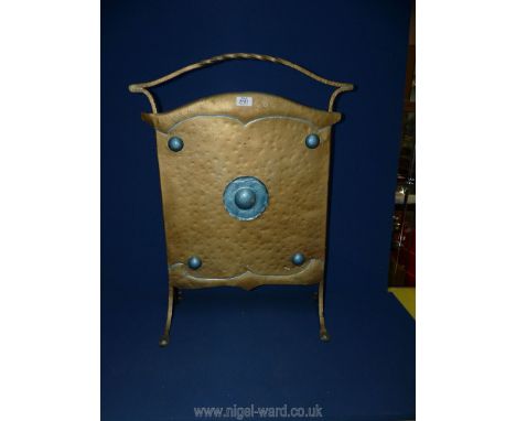 An Art Deco metal/brass firescreen having blue circles.