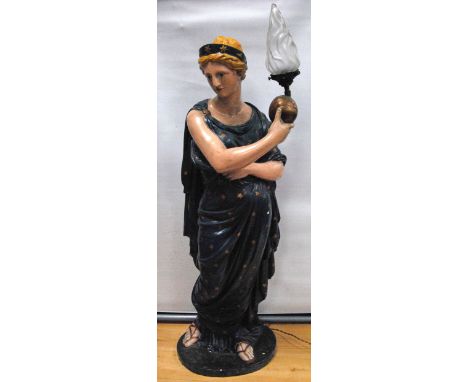 Plaster model of Liberty, holding a glass flame lamp.