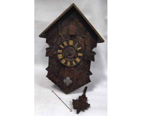 Swiss Black Forest carved walnut cuckoo clock, 40cm.   Condition Report  Some losses