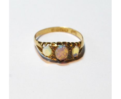 Opal three-stone ring with diamond points in 18ct gold, 1902.