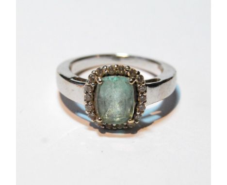 Aquamarine and diamond cluster ring in gold.   Condition Report  Size K