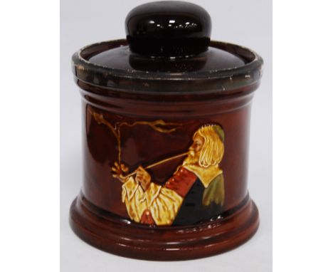 Royal Doulton silver-mounted King's Ware tobacco jar decorated with a pipe smoker, 17cm high.   Condition Report  The silver 