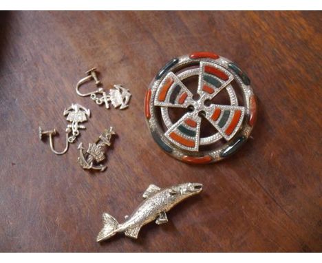A Scottish hardstone brooch, c. 1900, formed as a Celtic cross set with bloodstone and carnelian plaques, mounted in white me