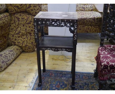 A Chinese marble-inset mother of pearl inlaid hardwood plant stand, c. 1900, the rectangular top above scroll carved aprons a