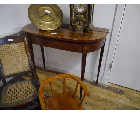 A George III style inlaid mahogany foldover card table, early 20th century, the D-end crossbanded and inlaid top opening to a