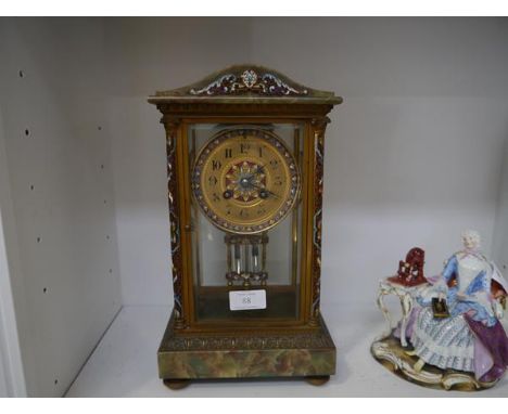 A French late 19th century champleve enamel and onyx mantel clock, the gilt dial with Roman numerals and enamelled bevel with