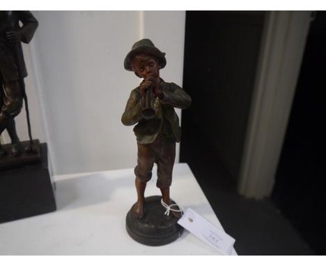 A French spelter figure of a boy playing a horn, signed Kessler and marked "France". 23cm